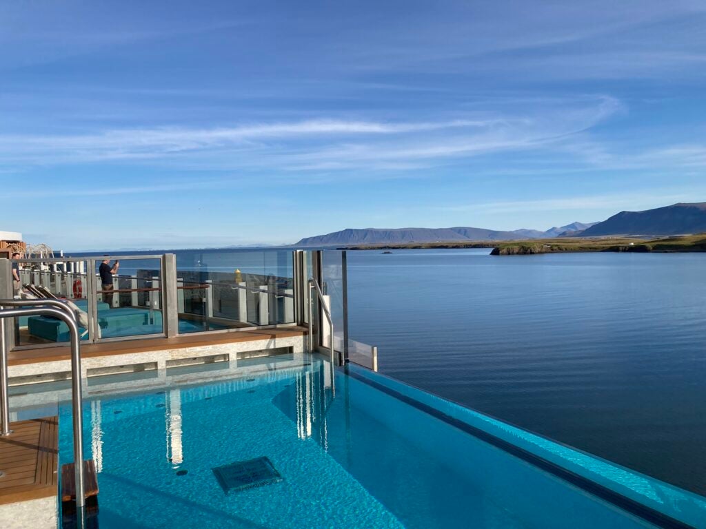 photo of the infinity pool on the new prima ship with a view of the coast of Iceland
