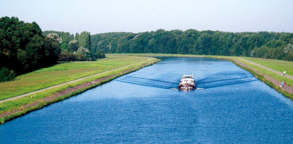 a boat traveeling down the Seine Nord Europe Canal in France